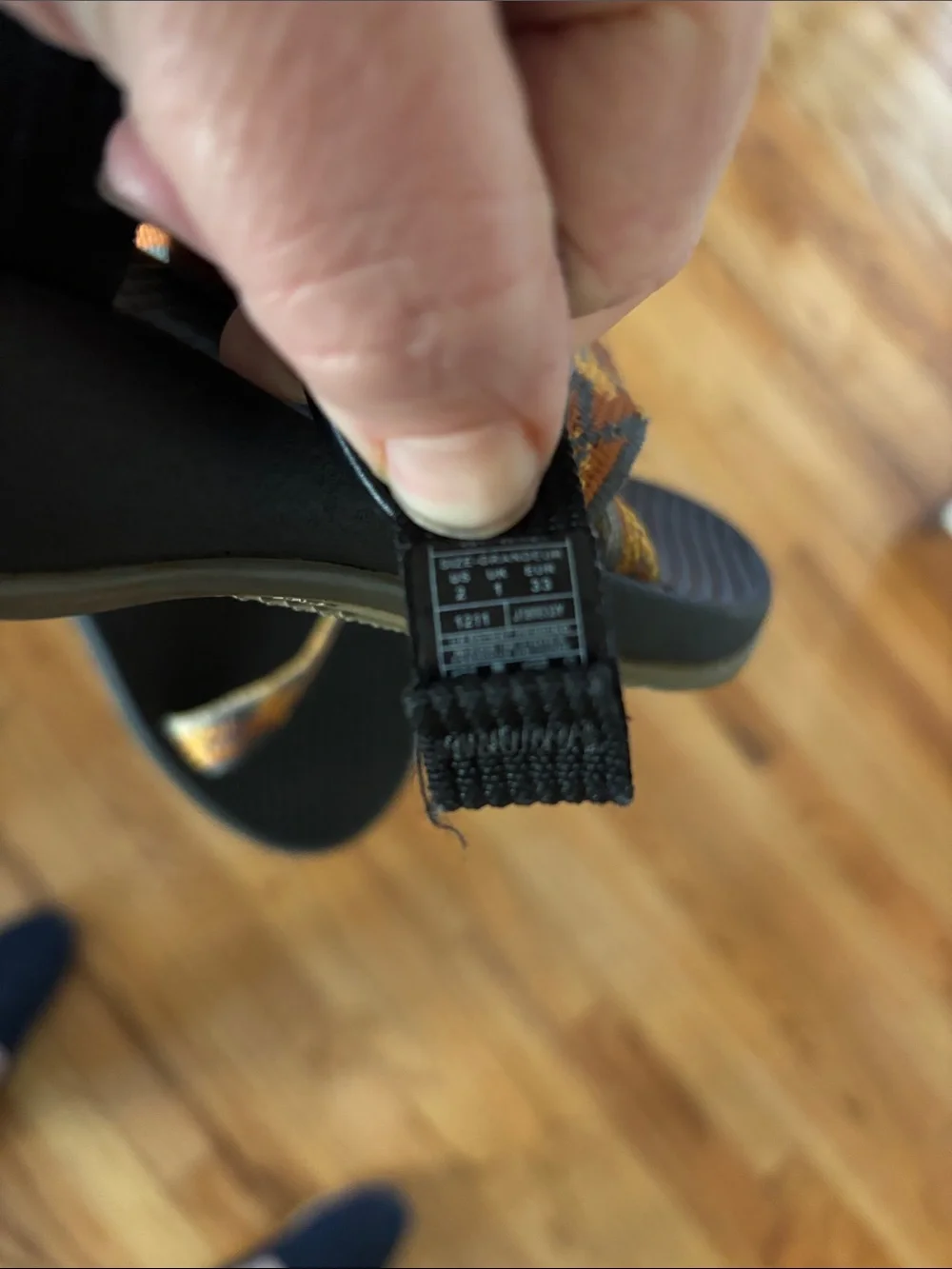 Chaco Black Sandals with Orange and Tan Patterned Straps